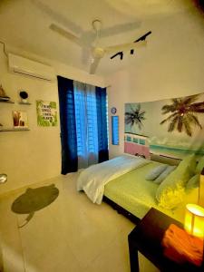 a bedroom with a bed and a window at Vintage Houze, fully aircond, Wi-fi, Netflix, Coway in Alor Setar
