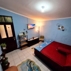 Postel nebo postele na pokoji v ubytování Ardian House Jepara