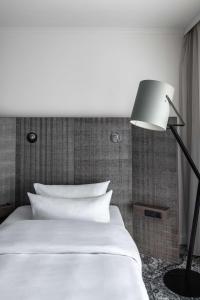 Postel nebo postele na pokoji v ubytování pentahotel Braunschweig