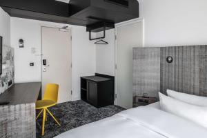 Postel nebo postele na pokoji v ubytování pentahotel Braunschweig