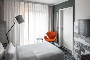 Postel nebo postele na pokoji v ubytování pentahotel Braunschweig
