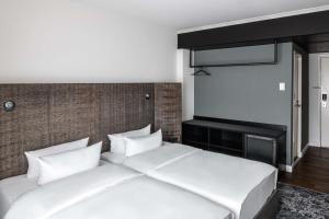 Postel nebo postele na pokoji v ubytování pentahotel Braunschweig