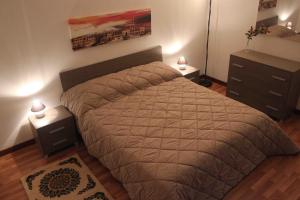 A bed or beds in a room at La Casetta