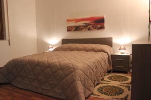 A bed or beds in a room at La Casetta