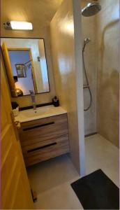 a bathroom with a sink and a shower with a mirror at Le Mas de Maupasset in Cabasse +29 photos