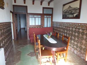 a dining room with a table and chairs at Casa Adelina in Morella