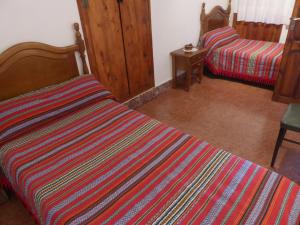 a room with two beds in a room at Casa Adelina in Morella