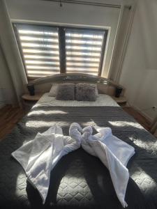 Postel nebo postele na pokoji v ubytování Apartament Hey Gron