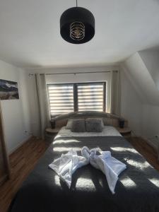 Postel nebo postele na pokoji v ubytování Apartament Hey Gron