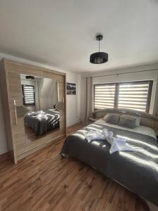 Postel nebo postele na pokoji v ubytování Apartament Hey Gron