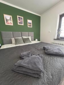 Postel nebo postele na pokoji v ubytování Apartament Hey Gron