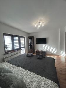 Postel nebo postele na pokoji v ubytování Apartament Hey Gron