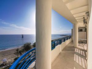 a balcony with a view of the ocean at Banana Beach in Marbella