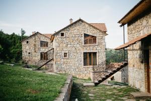an old stone house with a staircase in front at Apaga Resort in Ijevan