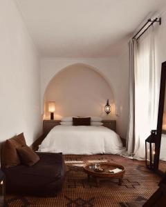 Postel nebo postele na pokoji v ubytování Riad Berbère Marrakech
