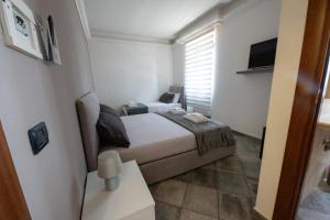 Ένα ή περισσότερα κρεβάτια σε δωμάτιο στο Mia Rooms