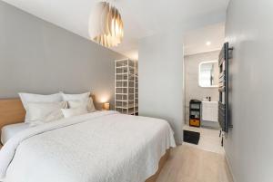 Postel nebo postele na pokoji v ubytování Ostend Central Residence