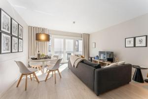 TV a/nebo společenská místnost v ubytování Ostend Central Residence