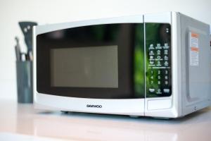 a microwave sitting on top of a counter at Loft Hermosa at Tulum's Mistiq Temple II Beaches in Tulum