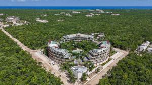 an aerial view of a building in the middle of a forest at Loft Hermosa at Tulum's Mistiq Temple II Beaches in Tulum