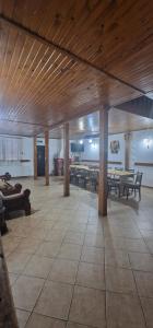 a room with tables and benches in a building at Cabana Sebes Bera in Făgăraş +18 photos