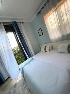 Voodi või voodid majutusasutuse Satos cozy crib toas