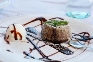 a dessert on a white plate on a table at Hotel La Certosa in Massa Lubrense