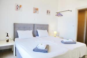 Postel nebo postele na pokoji v ubytování Ethereal - Seaview Apartment