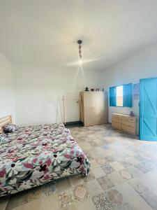 a bedroom with a bed in a room with blue walls at Las Cuevas - 3 bed finca in a serene setting in Santa Cruz de Tenerife