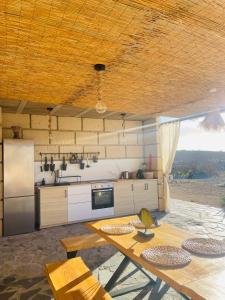 a kitchen with a table and a counter top at Las Cuevas - 3 bed finca in a serene setting in Santa Cruz de Tenerife