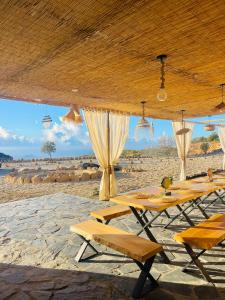 a group of tables and chairs on a beach at Las Cuevas - 3 bed finca in a serene setting in Santa Cruz de Tenerife