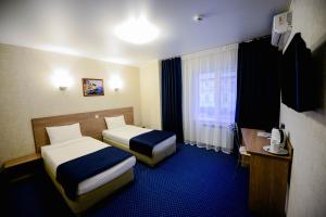 Кровать или кровати в номере Отель Арон