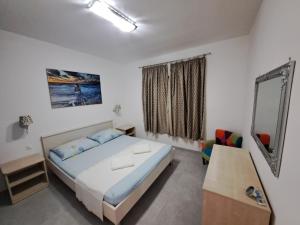 Posteľ alebo postele v izbe v ubytovaní Apartments Žgogo + 37 fotografií