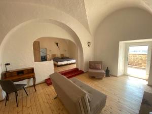 a living room with a bed and a desk at Burg Stettenfels in Untergruppenbach