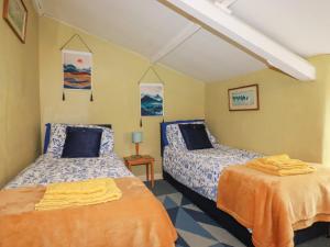 Voodi või voodid majutusasutuse Bramble Cottage toas