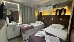 Rúm í herbergi á Solar de Pipa Vip Confort - Spa Hidro Flat