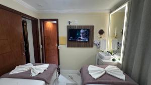 Rúm í herbergi á Solar de Pipa Vip Confort - Spa Hidro Flat