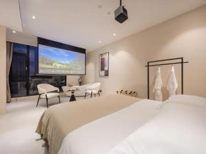 Uma cama ou camas num quarto em Dali Jiujing Inn