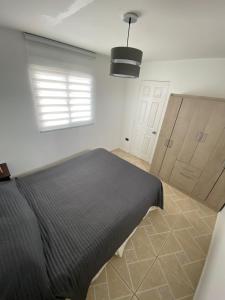 Ένα ή περισσότερα κρεβάτια σε δωμάτιο στο Casa acogedora dentro de parcela cerca de la playa