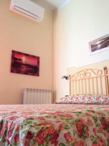 Postel nebo postele na pokoji v ubytování Lungomare Hotel