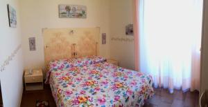 Postel nebo postele na pokoji v ubytování Lungomare Hotel