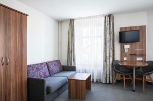 TV a/nebo společenská místnost v ubytování Hotel Resslirytti