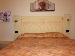 Postel nebo postele na pokoji v ubytování Lungomare Hotel