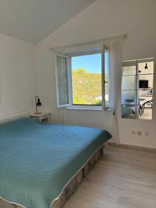 Posteľ alebo postele v izbe v ubytovaní Vidučić Apartments