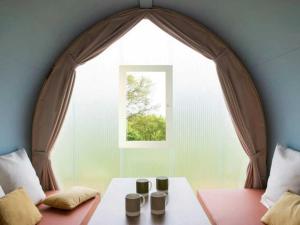 a room with a window with three cups on a table at Camping 4 étoiles - Piscine - efcfbi in Faverolles-sur-Cher +44 photos
