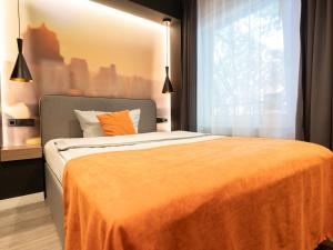 Ein Bett oder Betten in einem Zimmer der Unterkunft JustStay Ratingen Hotel & Apartments