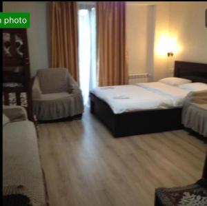 Voodi või voodid majutusasutuse David APT on Bakuriani Orbi Palace toas