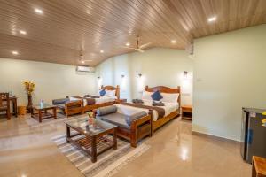Postel nebo postele na pokoji v ubytování Goa Beach Villa