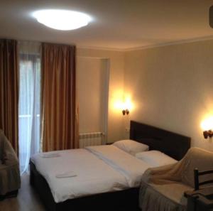 Postel nebo postele na pokoji v ubytování David APT on Bakuriani Orbi Palace + 25 fotografií