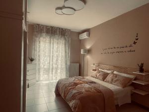 a bedroom with a bed with a quote on the wall at Alba Mare in Alba Adriatica